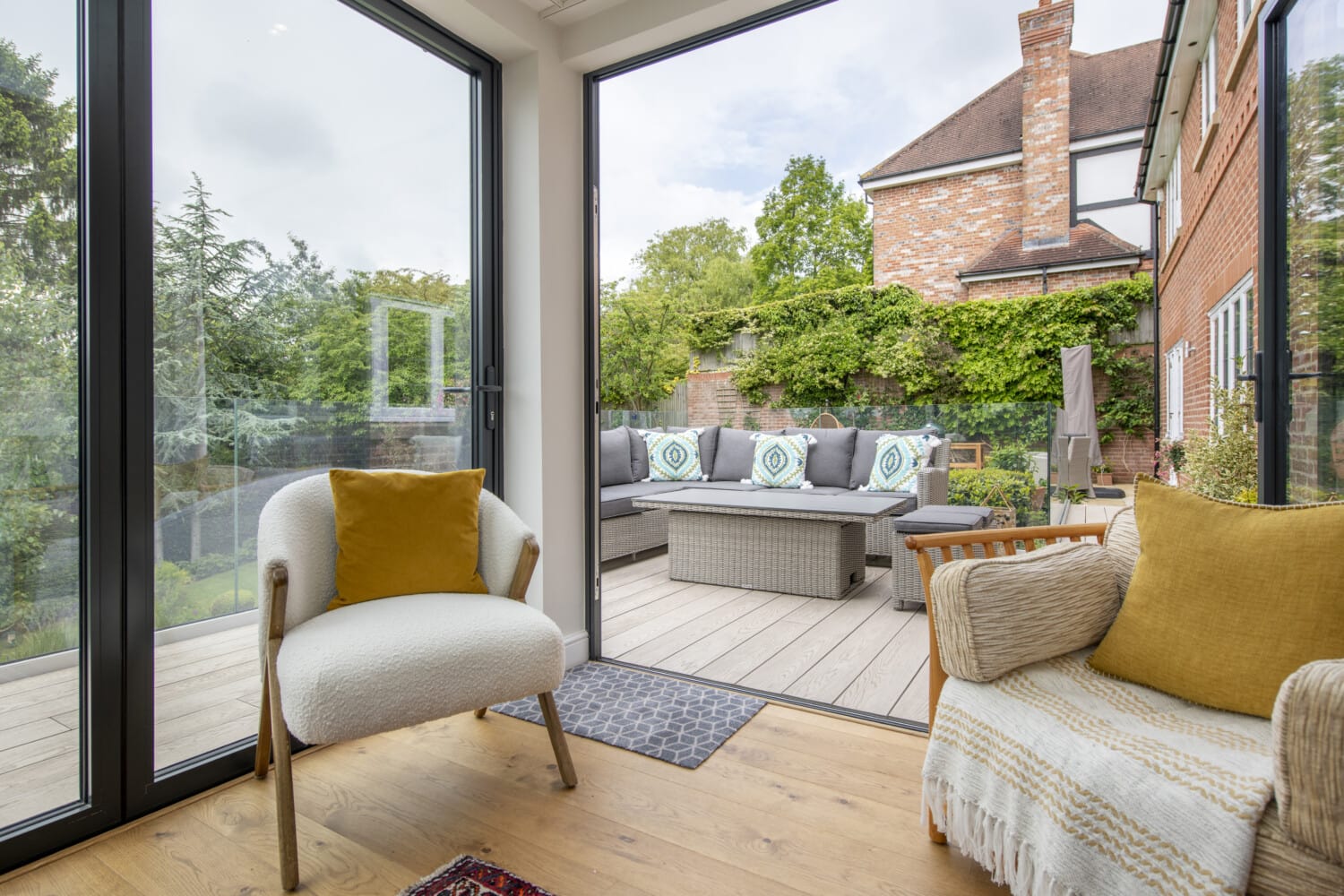 Open plan living room with aluminium doors